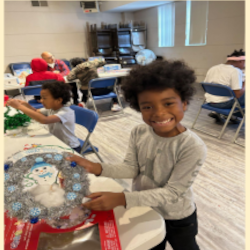 Photo of a child working with a mentor on a Sill Byrd Solar robot